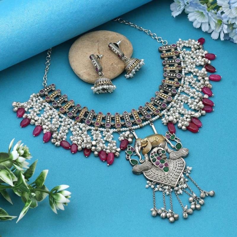 Rani & green color dual tone oxidised necklace set offering regal tones with ornate craftsmanship