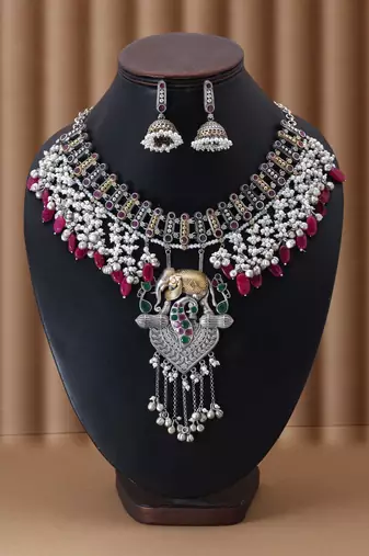Rani & green color dual tone oxidised necklace set offering regal tones with ornate craftsmanship