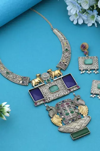 Multi color dual tone oxidised necklace set reflecting cultural artistry with striking decorative details