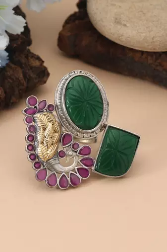 Rani & green color dual tone oxidised rings crafted with vibrant contrasting hues and ornate oxidised metalwork
