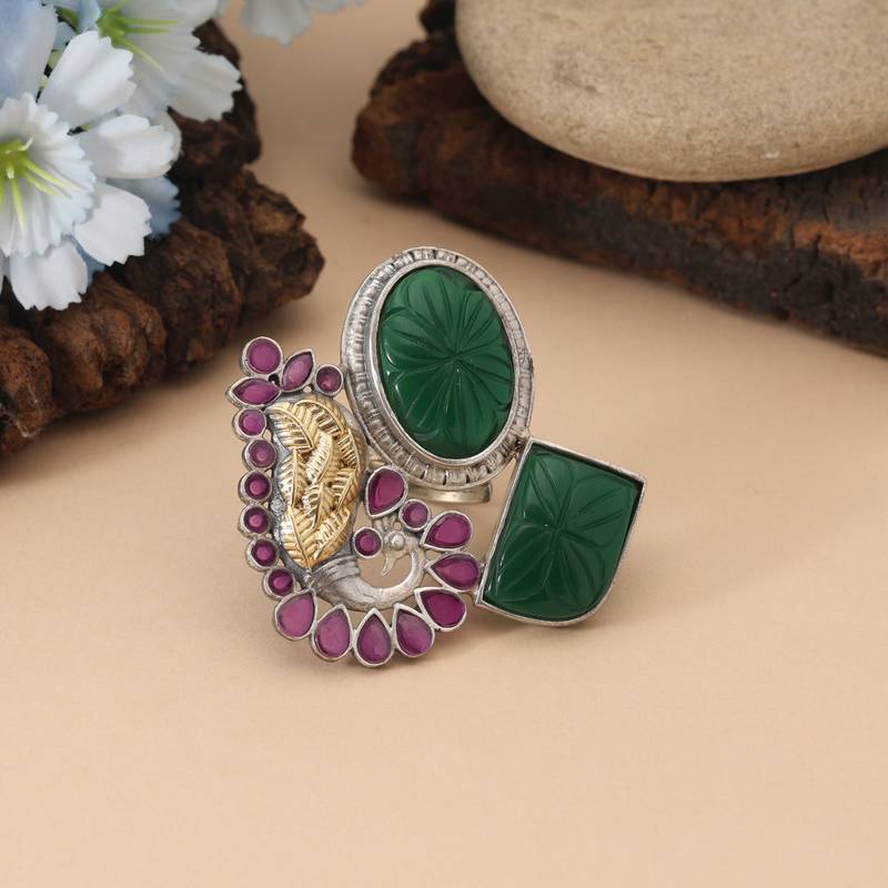 Rani & green color dual tone oxidised rings crafted with vibrant contrasting hues and ornate oxidised metalwork