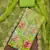 Green organza printed unstitched dress material