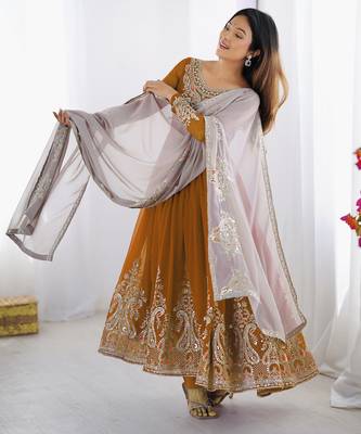 Trendy heavy georgette embroidery work mustard readymade gown 2