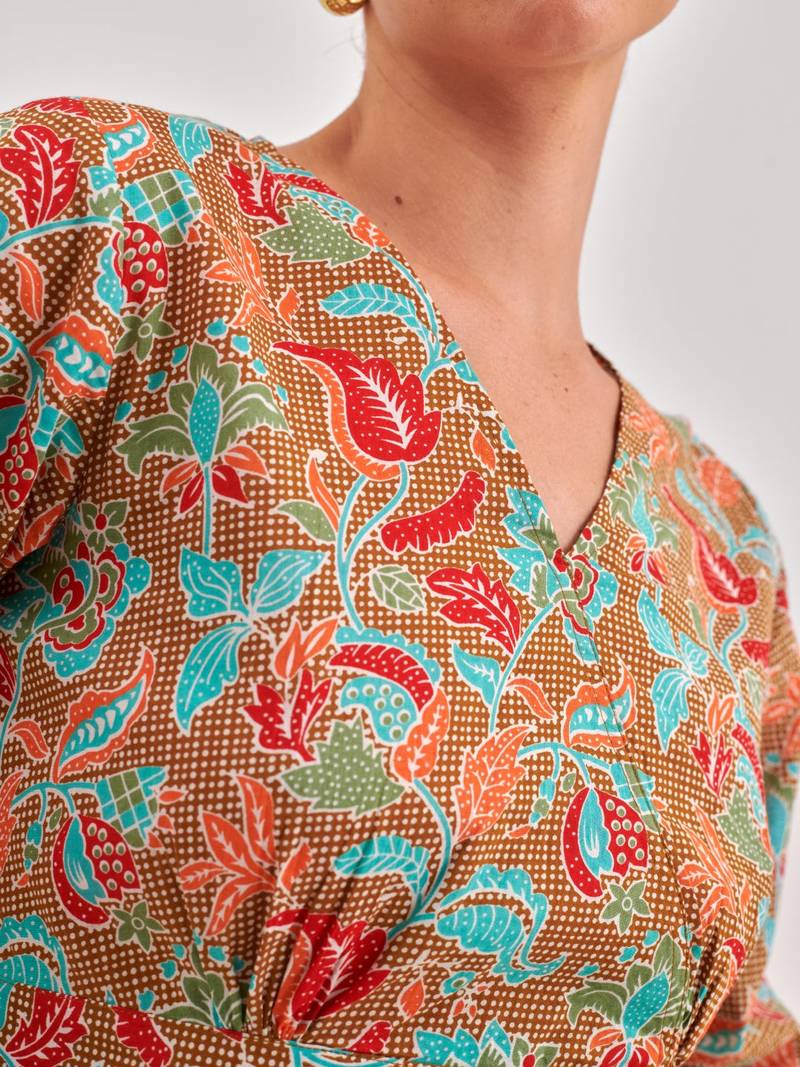 Khaki floral printed cinched waist top with v neck, long sleeves with ruffles