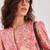 Pink floral printed long sleeve top with lace inserts and button placket