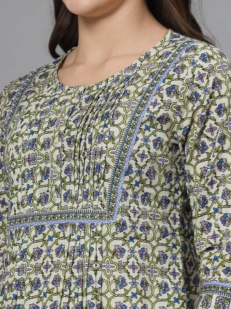 Tea green floral print pintucks top with round neck and button closure