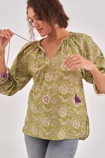 Fern green floral print puff sleeve cotton top with lace inserts, tie up neck & side slits