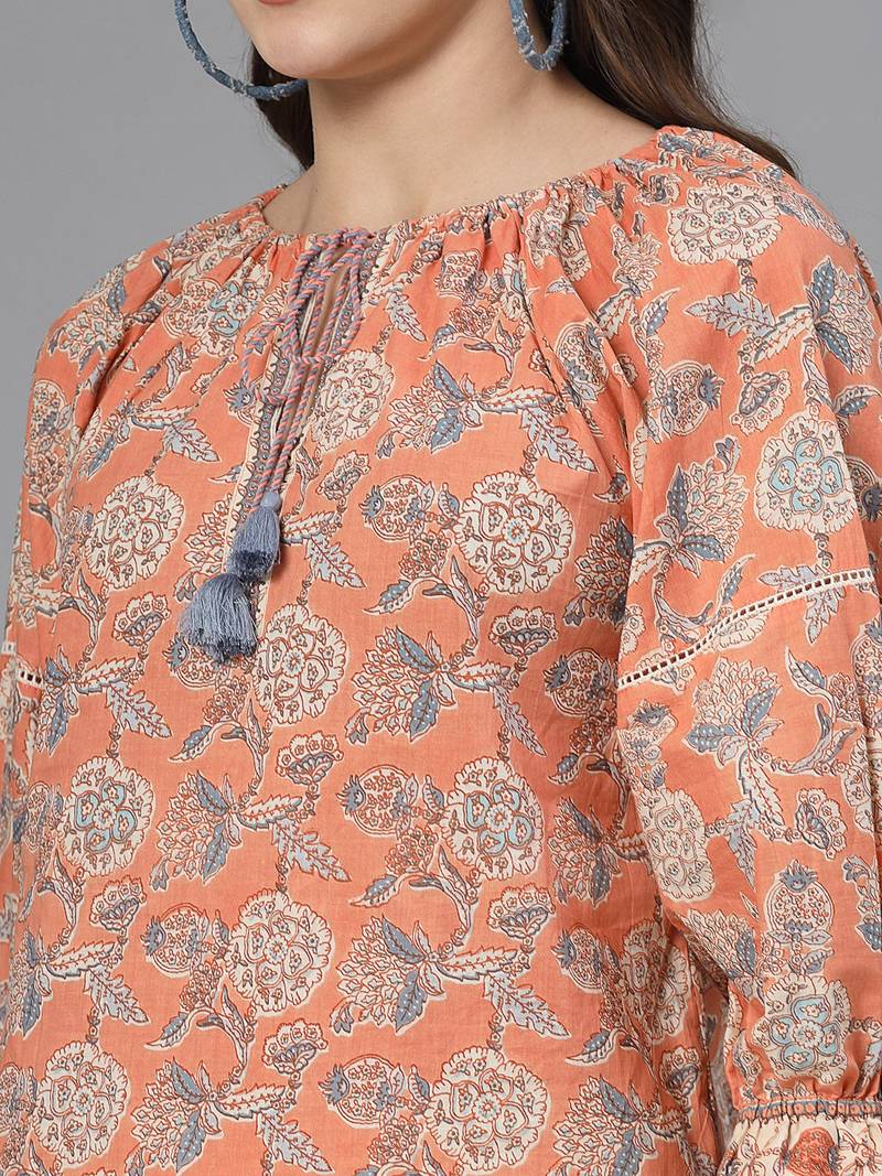 Apricot crush floral print puff sleeve cotton top with lace inserts, tie up neck & side slits
