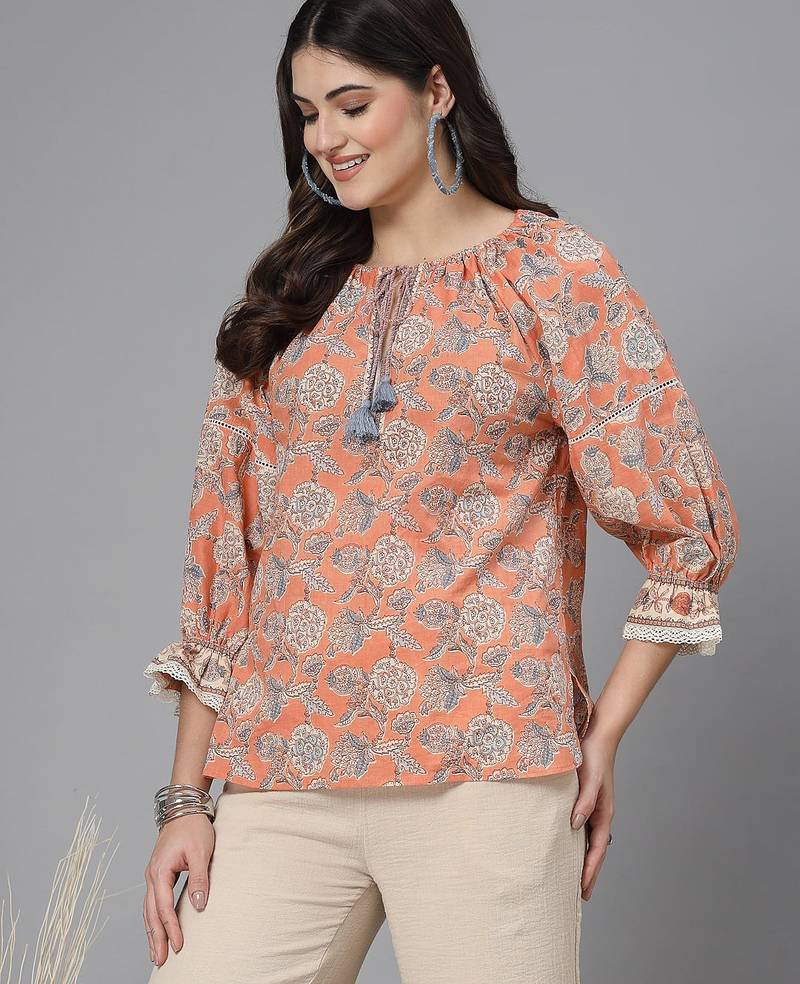 Apricot crush floral print puff sleeve cotton top with lace inserts, tie up neck & side slits