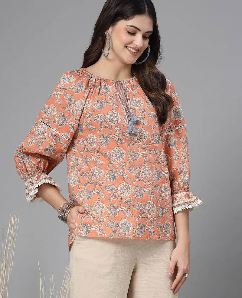 Apricot crush floral print puff sleeve cotton top with lace inserts, tie up neck & side slits