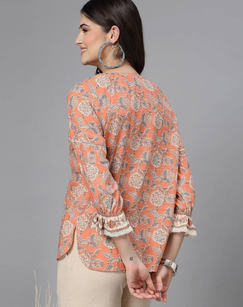 Apricot crush floral print puff sleeve cotton top with lace inserts, tie up neck & side slits