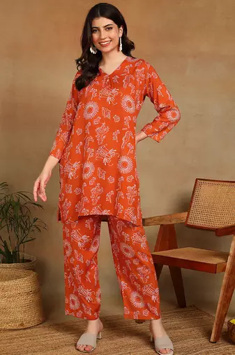 Women ethnic motifs printed orange rayon straight kurta with pants set