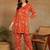 Women ethnic motifs printed orange rayon straight kurta with pants set