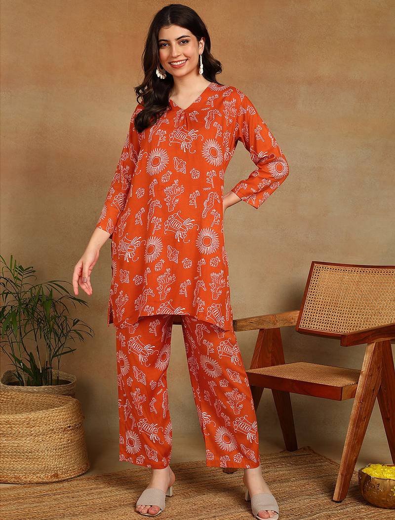Women ethnic motifs printed orange rayon straight kurta with pants set