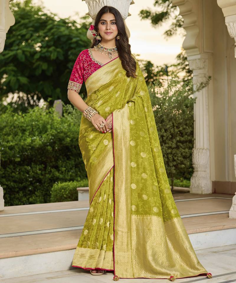 green green saree with contrasting pink blouse