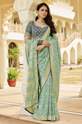 green elegant sea green saree with golden weaving
