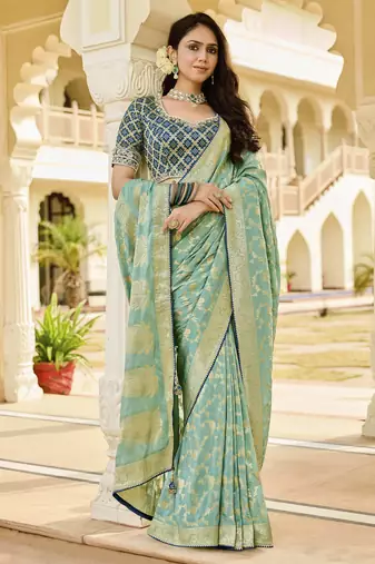 green elegant sea green saree with golden weaving