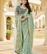 green elegant sea green saree with golden weaving