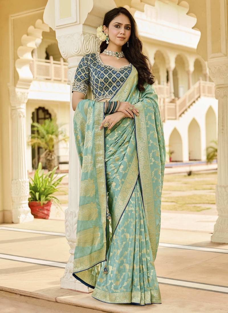green elegant sea green saree with golden weaving