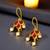 Gold plated pink stone maharashtrian bugadi earrings