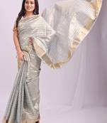 Grey color zari lining border orgenz saree with blouse