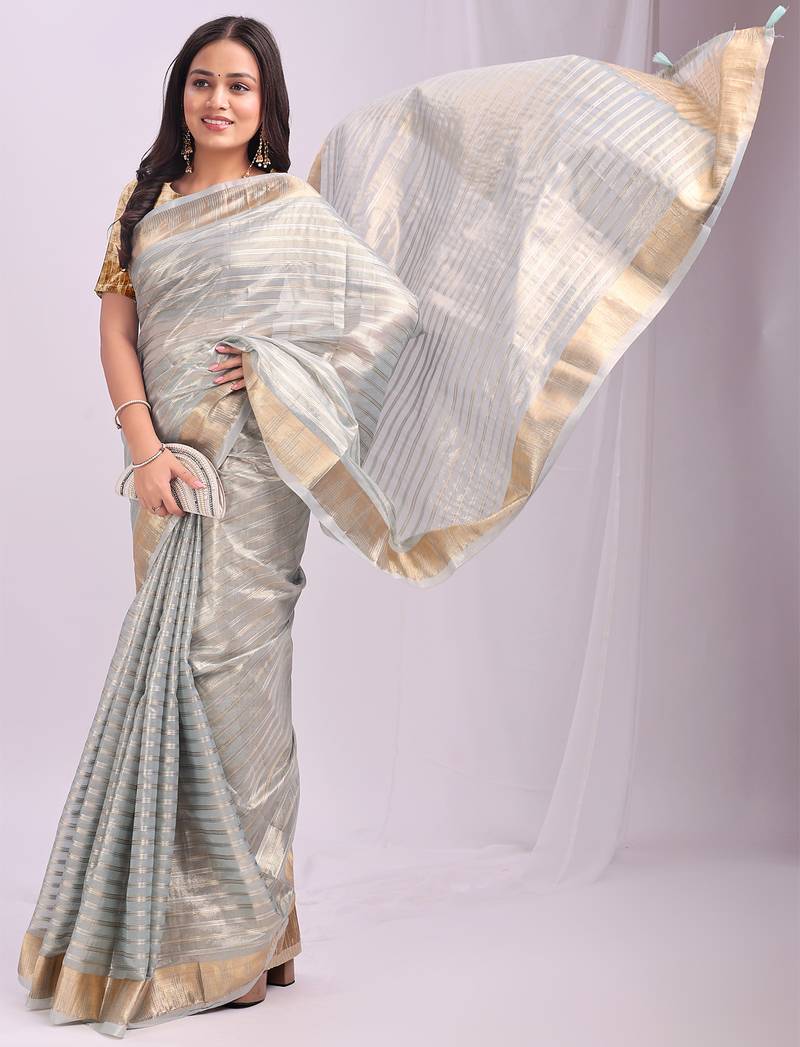 Grey color zari lining border orgenz saree with blouse