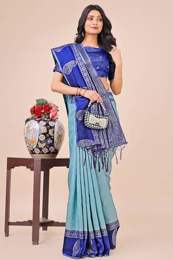 teal color woven lichi art silk blend saree with blouse