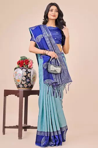 teal color woven lichi art silk blend saree with blouse