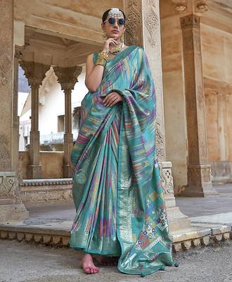 teal green soft silk blend woven patola printed saree 1