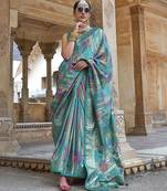 teal green soft silk blend woven patola printed saree