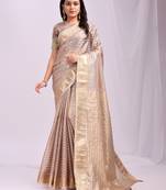 Beige color zari lining border orgenz saree with blouse