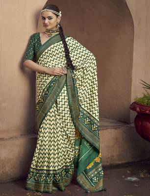 cream soft silk blend ikkat printed patola saree 1