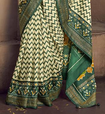 cream soft silk blend ikkat printed patola saree 4