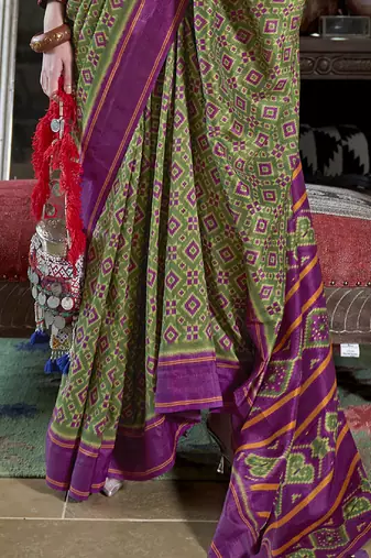 vibrant green soft silk blend ikkat printed patola saree
