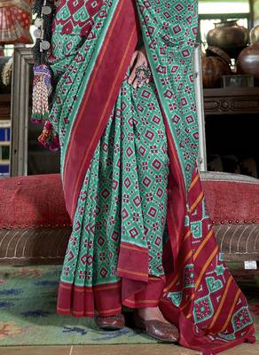 teal soft silk blend ikkat printed patola saree 4