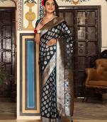 teal color zari woven silk blend saree with un-stitch blouse