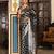 teal color zari woven silk blend saree with un-stitch blouse