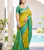 Mustard yellow & green pochampalli soft silk blend saree with traditional ikat pallu sari