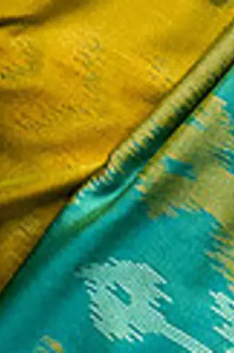 Mustard yellow & green pochampalli soft silk blend saree with traditional ikat pallu saree