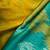 Mustard yellow & green pochampalli soft silk blend saree with traditional ikat pallu sari