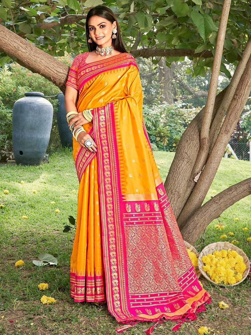 Graceful yellow banarasi silk blend saree with golden zari woven border & floral jaal     wedding & festive wear