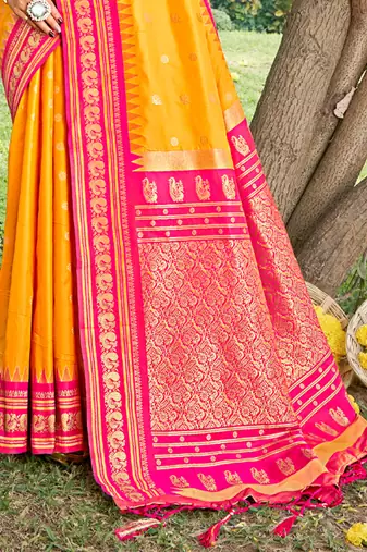 yellow banarasi silk blend saree with golden zari woven border