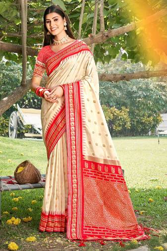 Graceful cream banarasi silk blend saree with golden zari woven border & floral jaal     wedding & festive wear