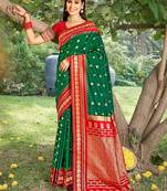 Graceful green banarasi silk blend saree with golden zari woven border & floral jaal     wedding & festive wear