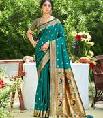 Graceful teal banarasi silk blend saree with golden zari woven border & floral jaal – wedding & festive wear