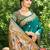 Graceful teal banarasi silk blend saree with golden zari woven border & floral jaal – wedding & festive wear