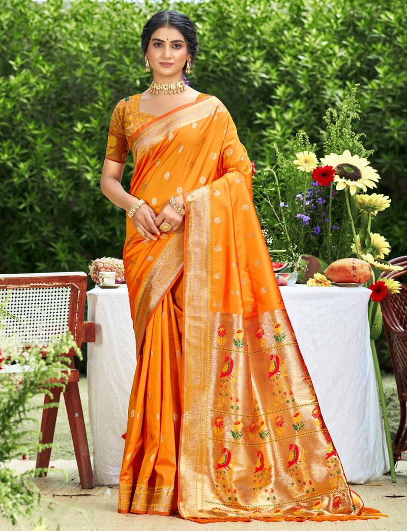 Graceful orange banarasi silk blend saree with golden zari woven border & floral jaal     wedding & festive wear
