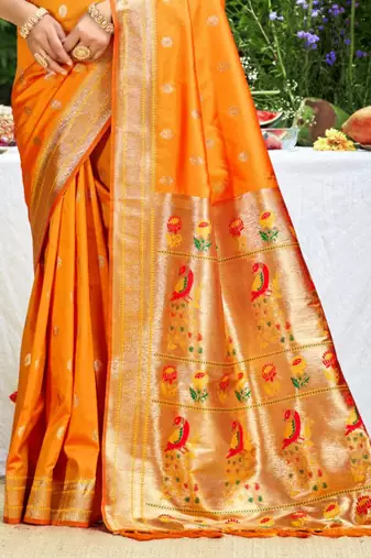 orange banarasi silk blend saree with golden zari woven border