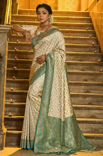 Ivory and sea green banarasi silk blend saree with golden zari     regal elegance for timeless celebrations