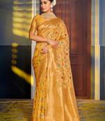Graceful yellow banarasi silk blend saree with golden zari woven border & floral jaal – wedding & festive wear